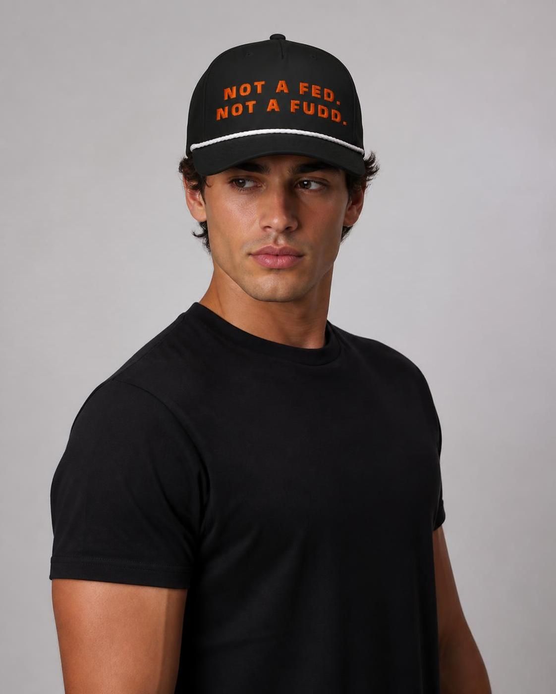 Man wearing the black Not A Fed. Not A Fudd. rope hat